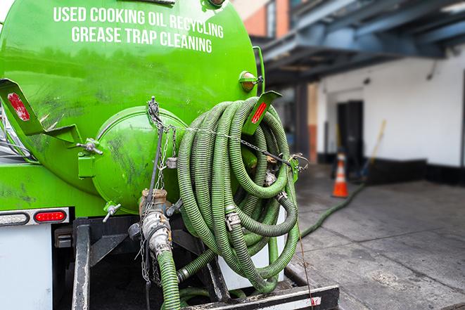 a service truck pumping grease from a restaurant's grease trap in Hillsboro, AL